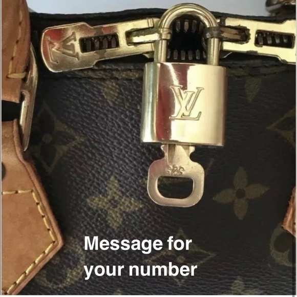 Louis Vuitton Accessories - NEAR MINT AUTHENTIC Louis Vuitton lock and key set.